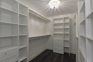 Spacious walk-in master closet with plenty of storage space