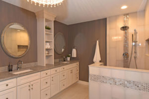 White cabinets and warm brown tones in master bathroom