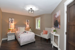 Bedroom with white trim and warm tones