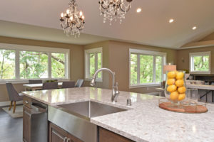 Cambria quartz island countertop with stainless steel farm sink